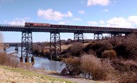 66148 passes over the Black Bridge, River Blyth with empty MEA waggons