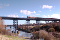 66148 passes over the Black Bridge, River Blyth with empty MEA waggons