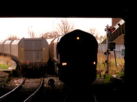 Two coal trains pass Ashington Signalbox