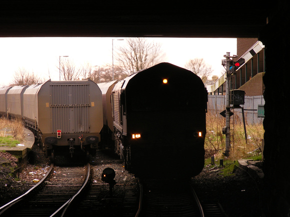 Two coal trains pass Ashington Signalbox