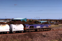 66724 "Drax Power Station" waits for the path to North Blyth which is blocked by 66723 "Chinook" with Fortwillam tankers.