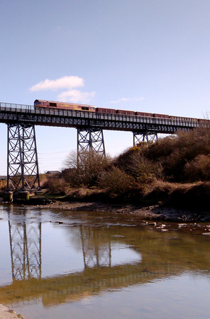 66079 "James Nightall G.C" passes over the Black Bridge.